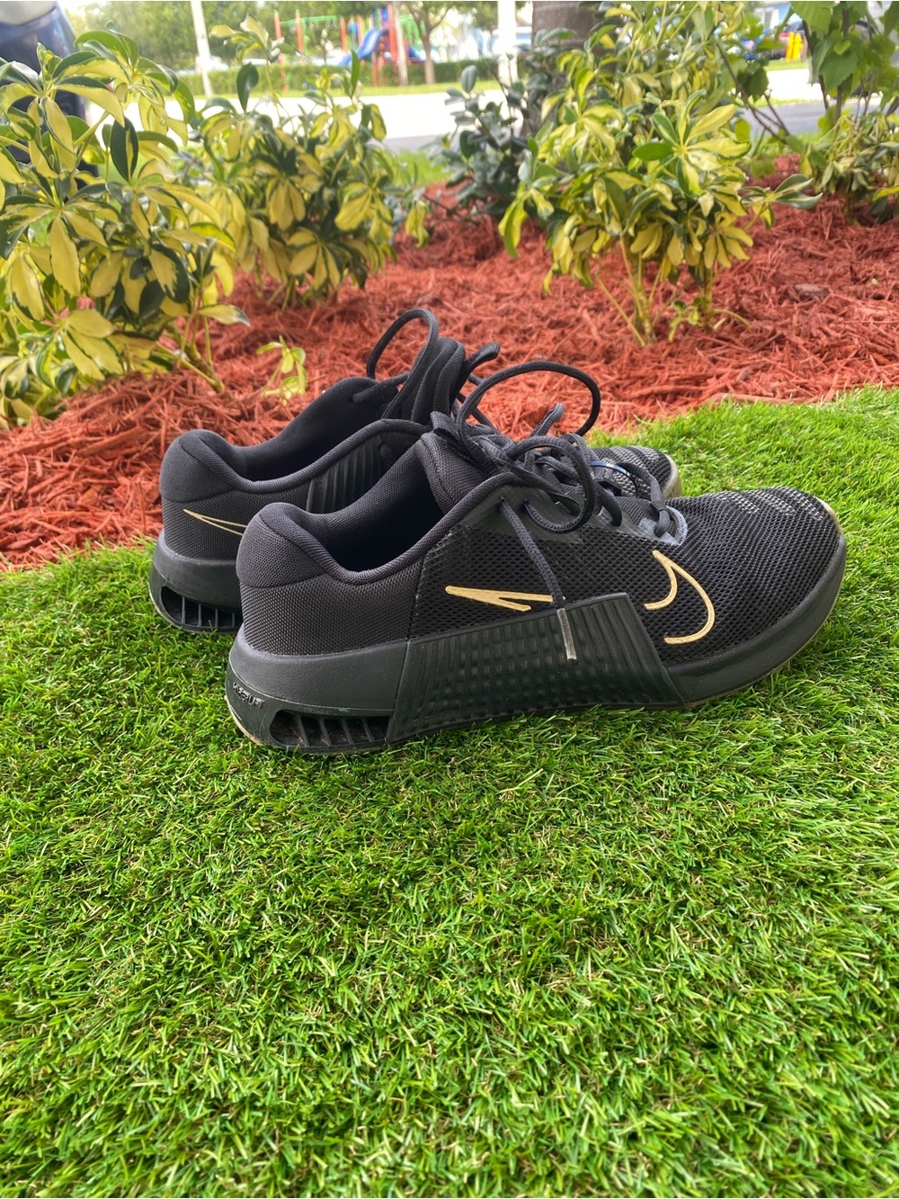 Nike Men’s Black Athletic Training Shoes with Gold Swoosh